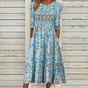 Mini dress with light blue floral print by Elizabeth